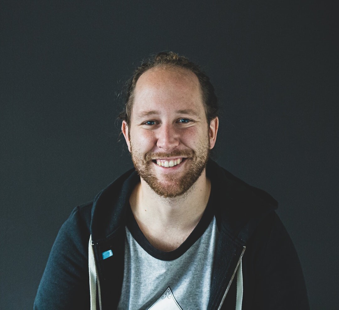Young man technology analyst smiling
