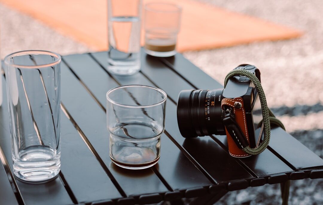 Camera gear including lenses and accessories on a table