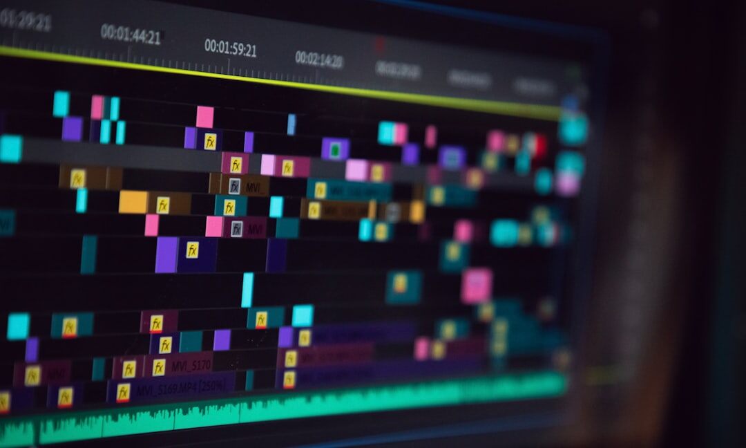 Video editing workstation with multiple monitors showing timeline software
