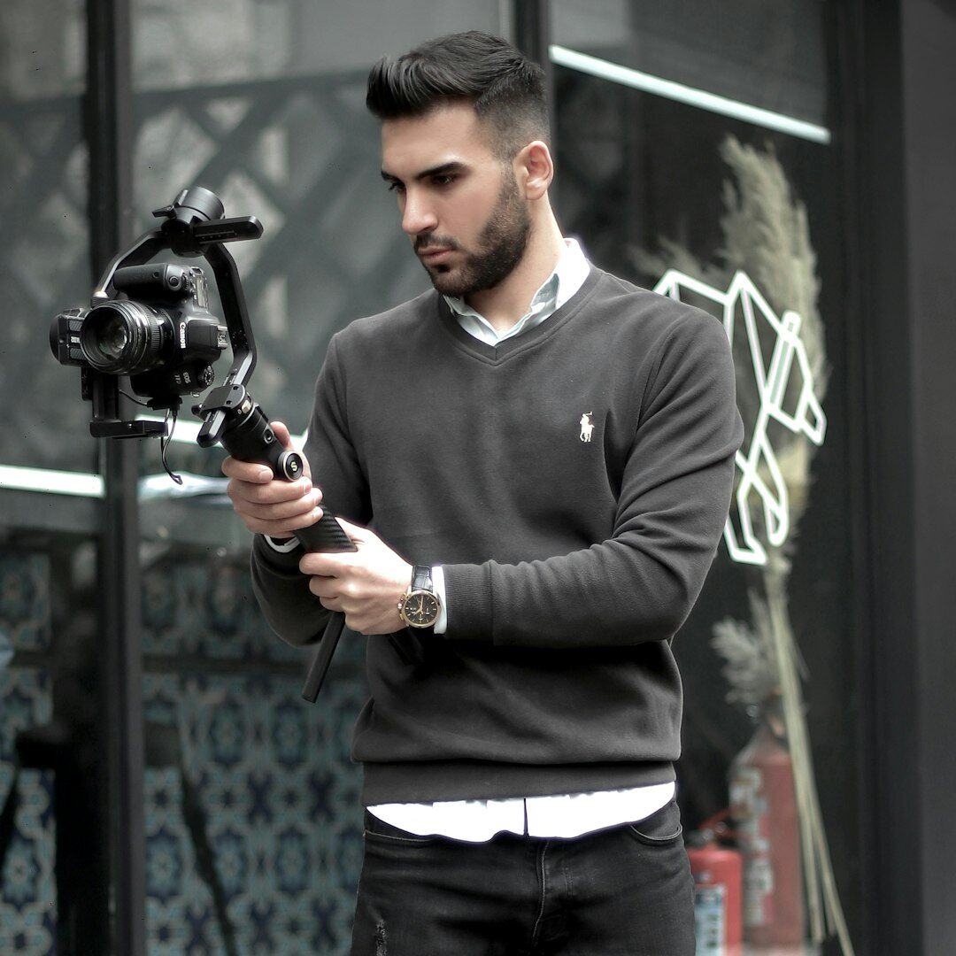 Turkish man video editor smiling at camera